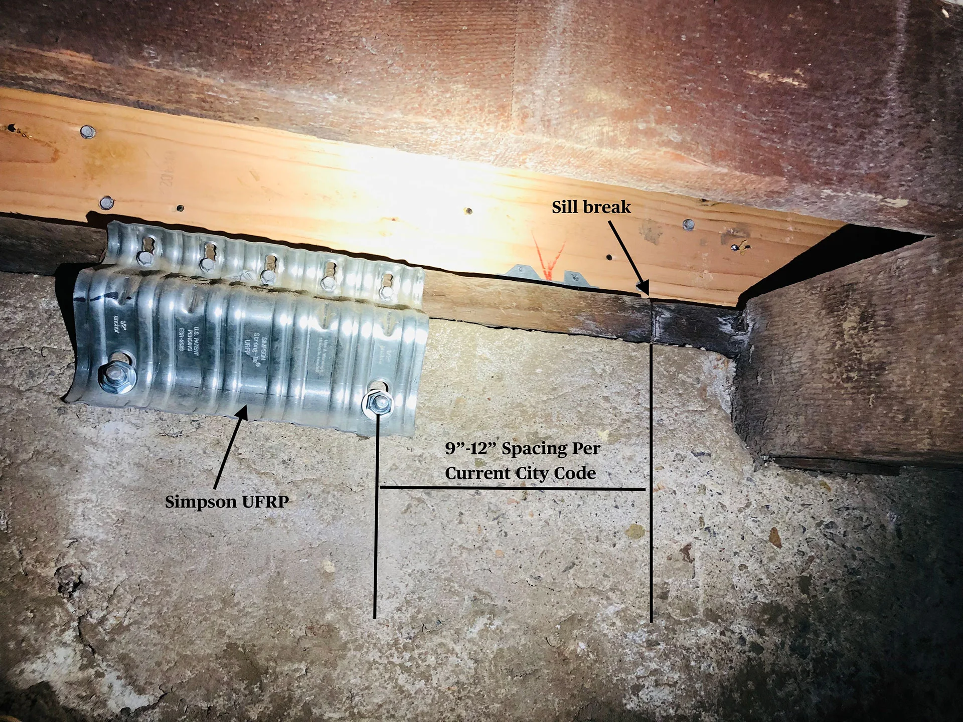 Seismic retrofit with Simpson UFRP and sill break for foundation repair in Los Angeles, meeting city code spacing requirements.